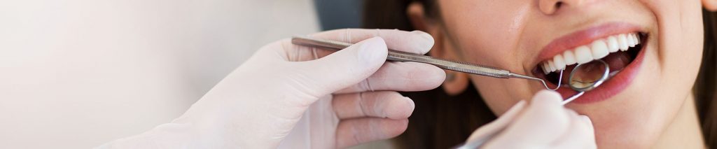 female patient getting a dental exam