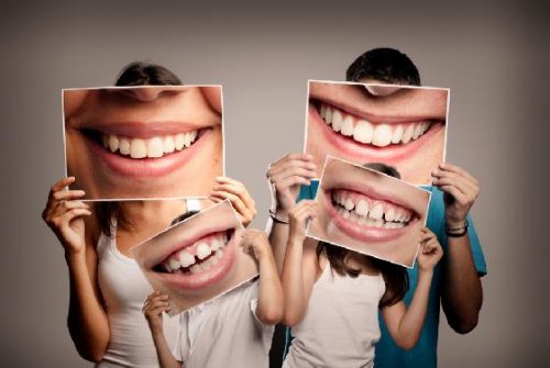 A family smiles after their family dentistry appointment